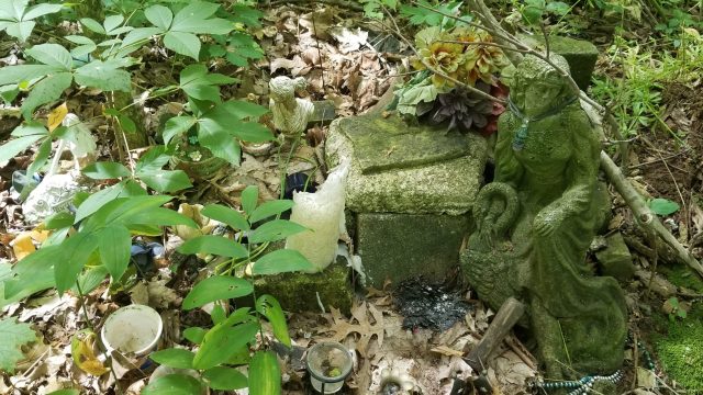 forest shrine with statue